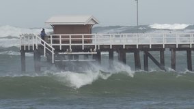 Big storm over the ocean. Huge waves crashing around pier. Victoria, Australia.