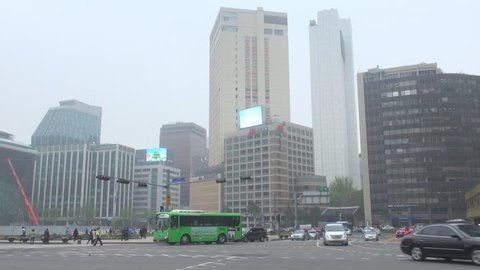 SEOUL - SOUTH KOREA, APRIL 20, 2012, Traffic street in downtown city in smog 