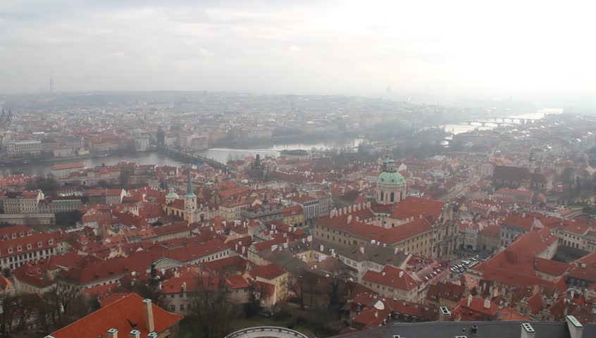 Scenic view of the historical center of Prague: buildings and landmarks of old town with red rooftops with carillons sound on the background