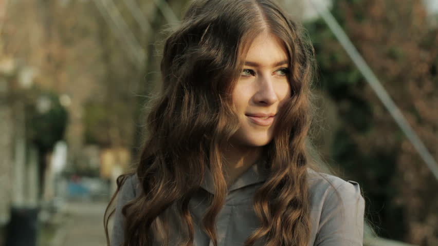 Portrait Close Up Of Beautiful Fashion Model Posing Outdoors And Looking At The Setting Sun  
