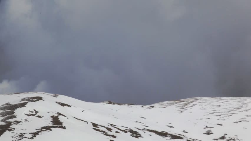 Snowy peaks to weather station,camera panning