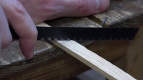 Close-up View of Man Sawing a Wooden Lumber. 4K Ultra HD 3840x2160 Video Clip