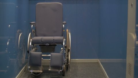Manual wheelchair left alone in the elevator