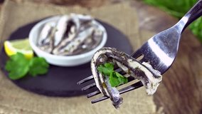 Portion of pickled Anchovies (not loopable 4K UHD footage)