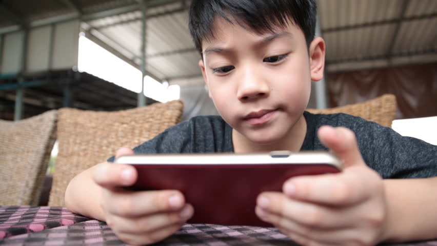 Asian Child Using a Digital Stock Footage Video (100% Royalty-free) 8879044  | Shutterstock