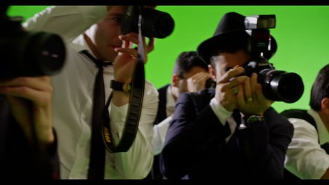 4K Group of paparazzi. Photo shoot on green screen. Slow motion. Shot on RED EPIC Cinema Camera.