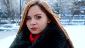 Girl smiling. Young woman winter portrait. Full HD footage