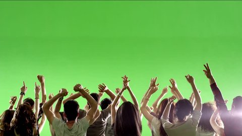 Crowd of fans dancing on green screen. Concert, jumping, Dancing.  Slow motion.  Shot on RED EPIC Cinema Camera.