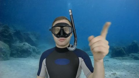 Diving sign- divemaster shows sign TURN BACK from diving course 3 of 14 also  available all diving sign on green screen (with full equipment)