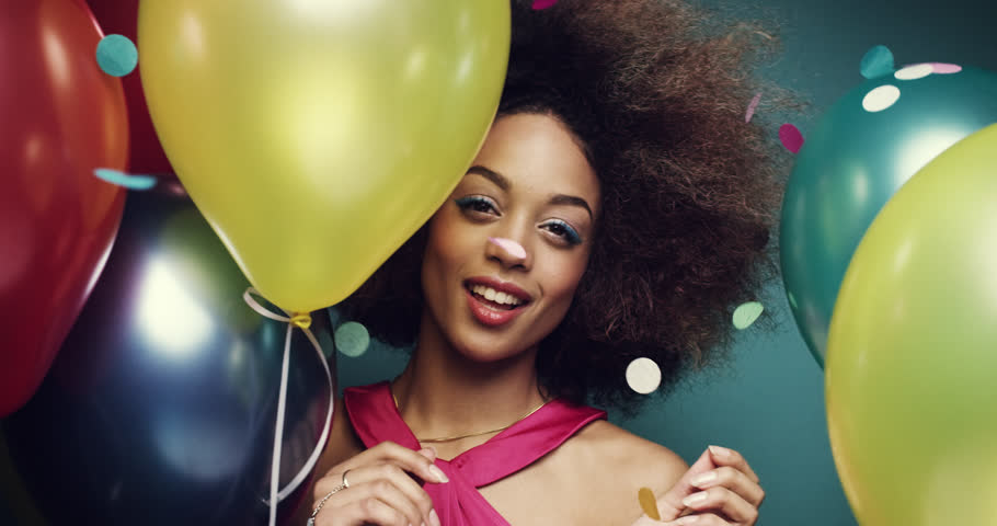 Beautiful young hispanic woman dancing celebrating birthday multicolored balloon background - Red Epic Dragon