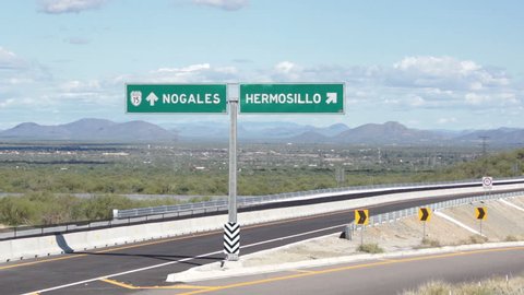 Overpass and turnoff in the United States and Mexico border region that allows a traveler to drive to Nogales or to Hermosillo along highway 15.