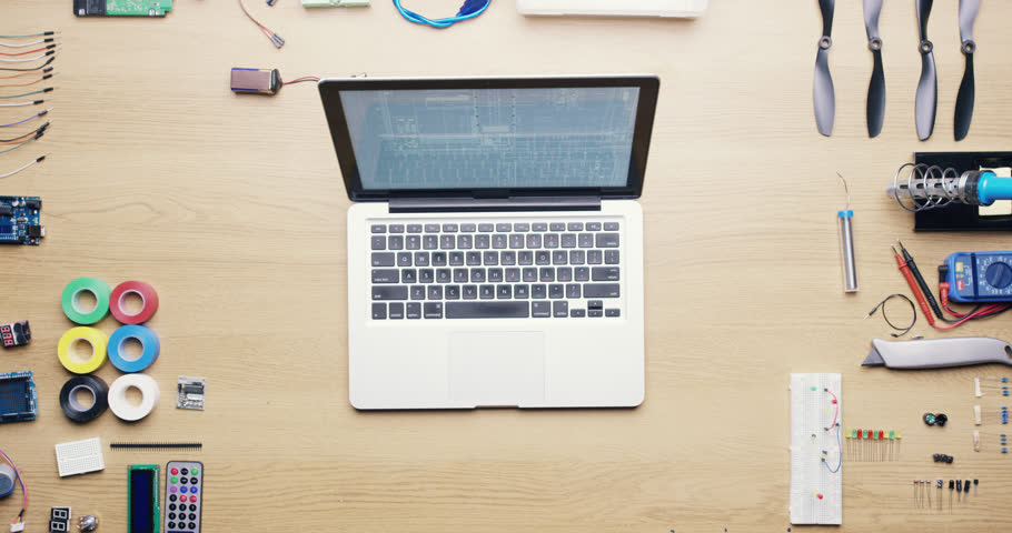Top view software engineer drinking coffee using laptop computer at desk from above - Red Epic Dragon