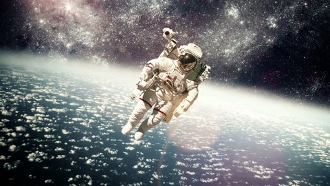 Стоковое видео: Astronaut in outer space against the backdrop of the planet earth. Elements of this image furnished by NASA.