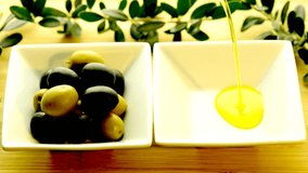olive oil running into a glass bowl