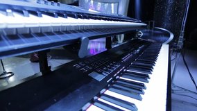 Beautiful Pan of Two Keyboards on a Stage.  Close up Shot. 