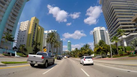 MIAMI BEACH - FEBRUARY 14: Driving along Collins Avenue with a car mounted camera shot at 2.7k 60p for smooth playback or slow motion February 14, 2015 in Miami Beach USA
