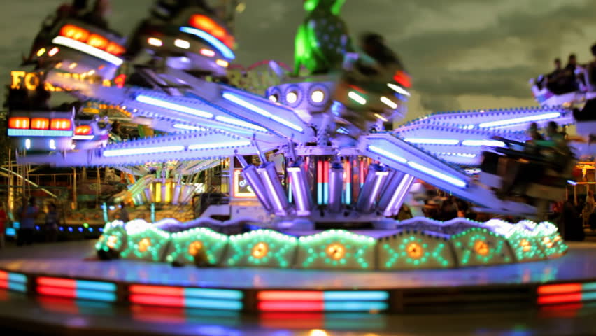 An amusement ride at a carnival or fair in barcelona spain, slightly blurred version | Shutterstock HD Video #890800