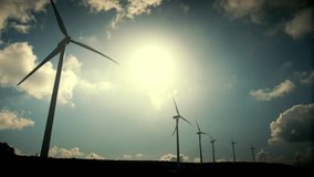 A series of real time hd clips of wind turbines at a mountain site generating clean renewable energy.