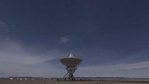 4K Time lapse zoom out Very Large Array Radio Telescopes dish alignment at night with stars in New Mexico, USA