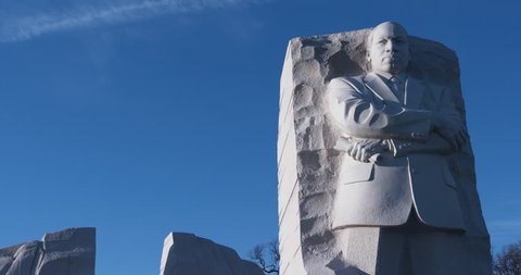 MLK medium shot. The Martin Luther King, Jr. Memorial in Washington D.C. Winter. Blue sky. "Out of the mountain of despair, a stone of hope." "I Have A Dream"