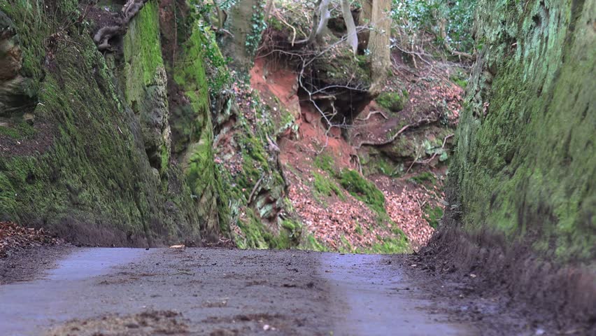 Narrow Country Lane Surrounded Rock Face - Offley Rock, Staffordshire, England