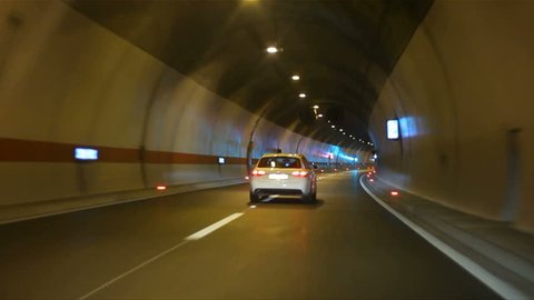 Car driving on highway tunnel