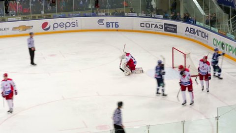 MOSCOW, RUSSIA - FEBRUARY 20, 2015: Hockey players ram goal in gates on hockey match "CSKA" (Moscow) - "Dinamo" (Moscow) in the Luzhniki Small Sports Arena.