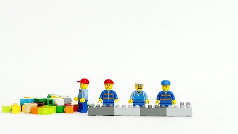 Orvieto, Italy - February 22th 2015: team of workman Lego mini figure build a wall in stop motion. Lego is a popular line of construction toys manufactured by the Lego Group