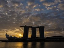 4K video time lapse : Singapore skyline at sunrise with amazing moving cloud.