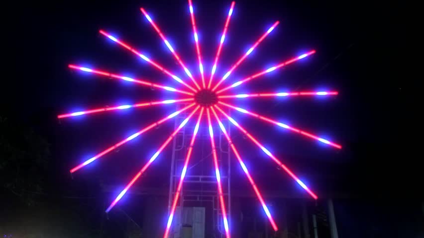 Red, illuminated colorful star on night market. HD. 1920x1080