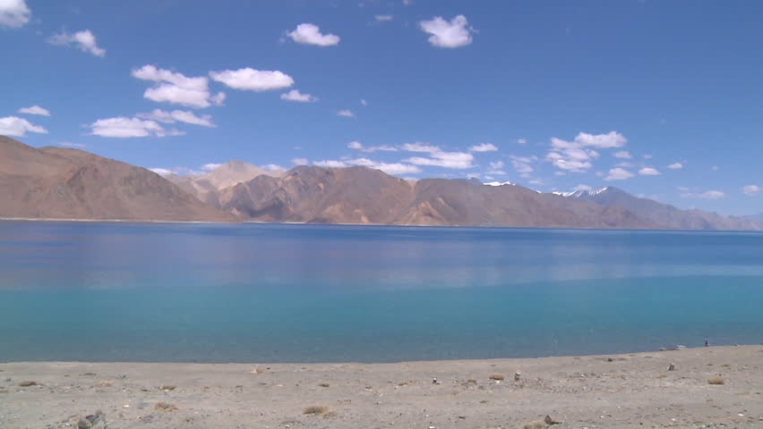 Pan Wide Shot of mountains and the Pangong Lake at Ladakh in Jammu and Kashmir, India