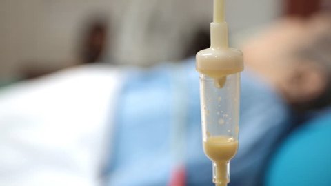 Close up of Liquid food drip , face out of focus in vip room at hospital .