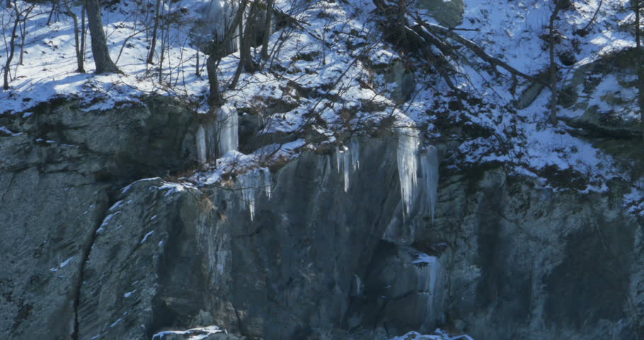Icicles Hanging off Rock Cliff on Mountain
