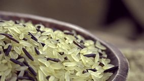 Heap of mixed rotating Rice (seamless loopable 4K footage)