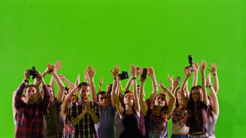 4K Crowd of fans and paparazzi on green screen. Dancing, photo shooting, Slow motion. Shot on RED EPIC Cinema Camera.