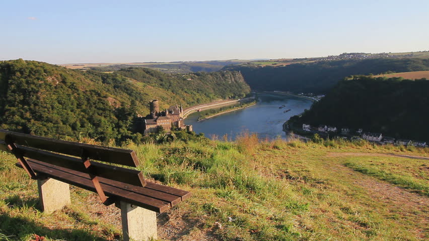 View on rhine river with ruin and bench