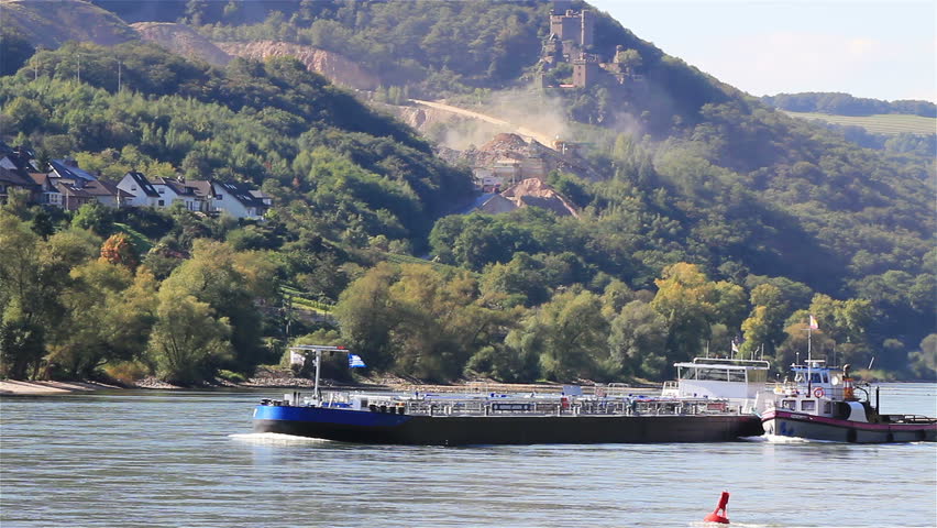 Two ships on the rhine river - ruin in the background
