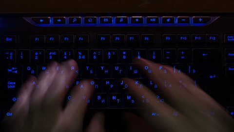 Russian Hacker Typing On Backlit Keyboard, time lapse