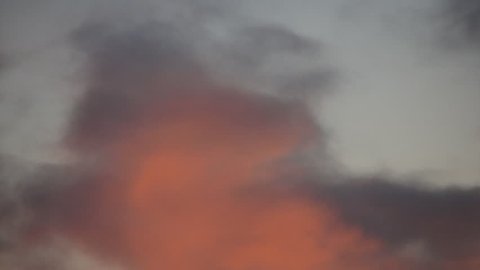 evening sky time-lapse covering about 15 min during sunset, zooming out at end of sequence, Norway