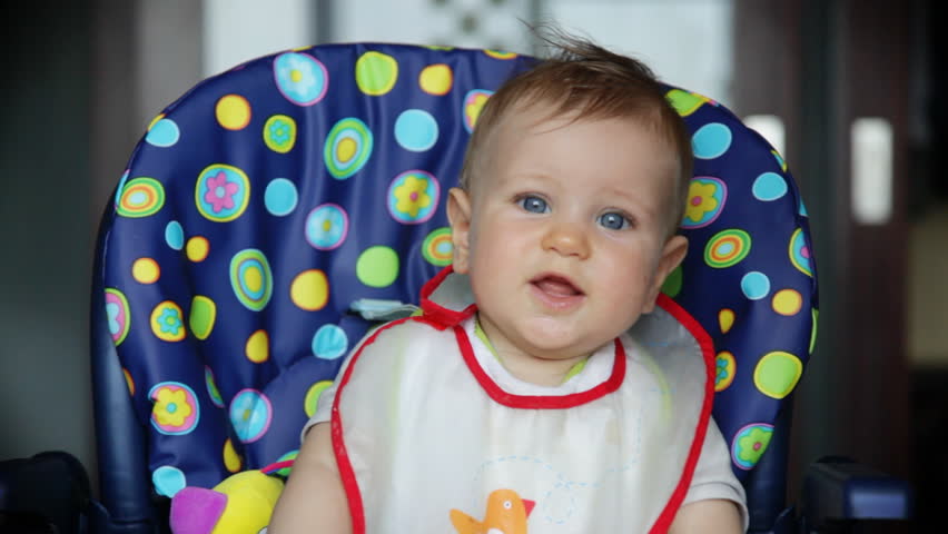 Happy baby boy at lunch time