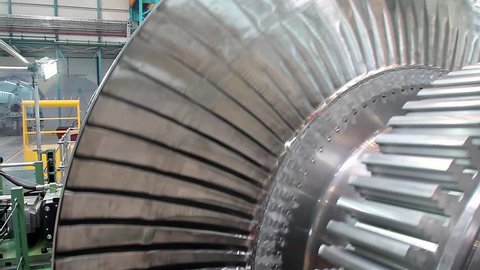 Turbine rotates at a plant producing power steam turbines 