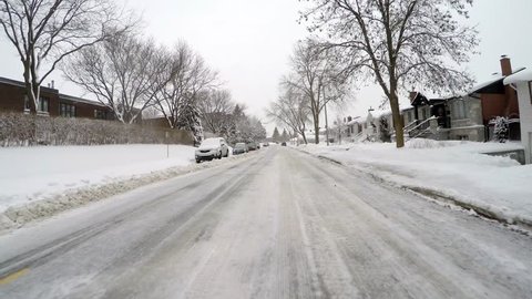 MONTREAL, CANADA - December 2014 : Typical North American snow storm in a Canadian neighborhood.