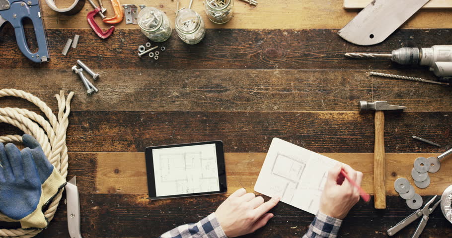Top view artisan craftsman using touch screen tablet technology touchscreen workshop from above - Red Epic Dragon