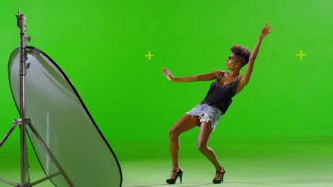 FEW SHOTS! 4K African Stylish Girl Dancing On Green Screen. Real Strobe Light On Body. Slow Motion. Few shots.