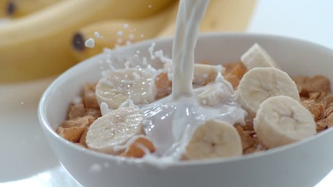 Milk pouring into bowl of cereal and bananas in slow motion; shot on Phantom Flex 4K at 1000 fps