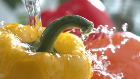 Water splashing on bell peppers in slow motion; shot on Phantom Flex 4K at 1000 fps - Powered by Shutterstock - Get 15% off with code: PIKWIZARD15