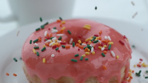 Sprinkles falling onto donut in slow motion; shot on Phantom Flex 4K at 1000 fps