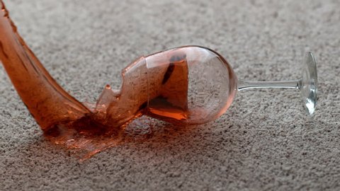 Glass of red wine spilling on carpet in slow motion; shot on Phantom Flex 4K at 1000 fps