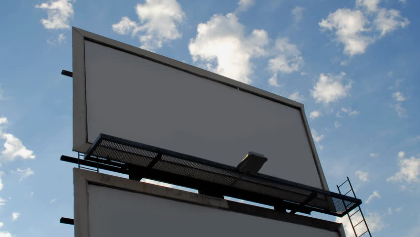 Blank billboard against clouds time lapse