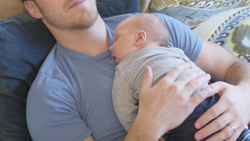 newborn sleeping on chest